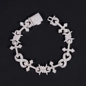 Close-up detail of a 12mm hip hop bracelet with moissanite-encrusted cross and infinity links
