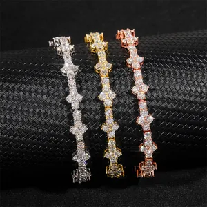 Detail of three Moissanite tennis chains in silver, gold, and rose gold finishes.