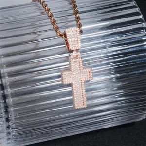 Macro detail of a rose gold hip hop cross pendant with pave moissanite stones