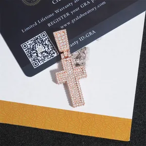 Close-up of iced out moissanite cross pendant with GRA warranty card