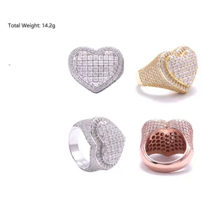 Detail view of heart-shaped moissanite rings in silver, gold, and rose gold finishes