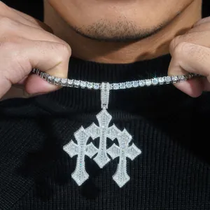 Detailed macro view of a 925 silver moissanite cross pendant on a tennis chain.