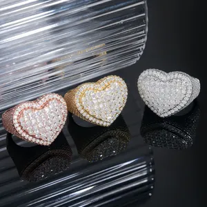 Detailed view of hip-hop heart rings in rose gold, yellow gold, and silver finishes