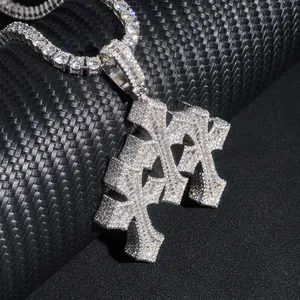 Close-up detail of silver moissanite cross pendant necklace with tennis chain style