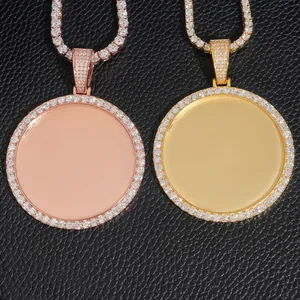 Detailed macro view of gold and rose gold iced-out photo frame pendants for personalized photos