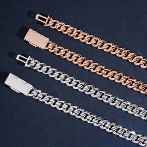 Close-up of 10mm Cuban link chains with S925 engraved clasps in silver and gold