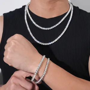 Detailed view of moissanite tennis chain necklace and bracelet set on male model