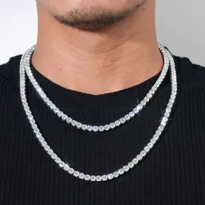 Close-up detail of a 4-5mm moissanite tennis chain necklace worn by a male model