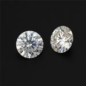 Macro detail of brilliant round cut D color Moissanite loose stones on black.
