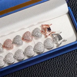 Detailed view of 13mm heart moissanite cuban link bracelets in a blue jewelry box.