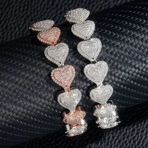 Macro detail of 13mm iced out heart Cuban chain with D color Moissanite in S925 silver