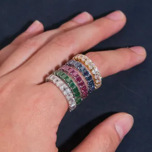 Detailed view of colorful emerald cut moissanite eternity rings on hand in 925 silver