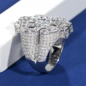 Detailed view of hip-hop dollar sign ring encrusted with brilliant moissanite stones