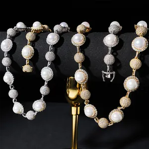 Detail view of 10mm pearl and pavé moissanite hip hop necklaces in gold and silver