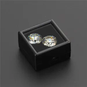 Close-up of two brilliant D color hearts and arrows moissanite stones in a black box