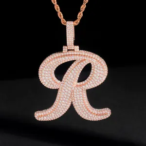 Detailed macro view of the iced-out moissanite letter R pendant in a rose gold finish