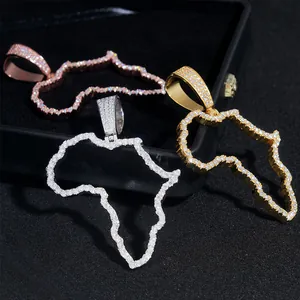 Macro view of iced out hollow Africa map pendants in rose, gold, and silver finishes