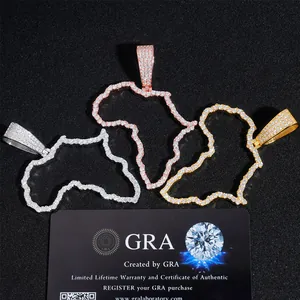 Close-up of three Africa map moissanite pendants in silver and gold with GRA card