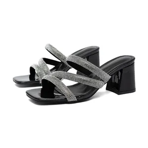 Elegant black square-toe sandals with sparkling rhinestone straps and chunky heels