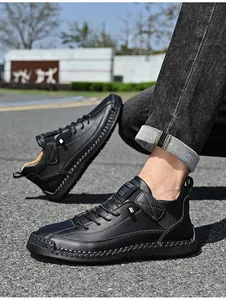 Premium men's black casual leather shoes with hand-stitched soles and sport label