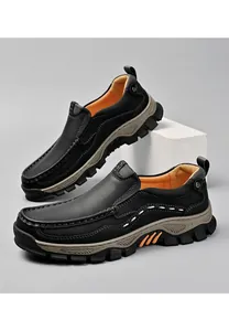 Professional detailed side view of black leather outdoor slip-on loafers for men with thick soles