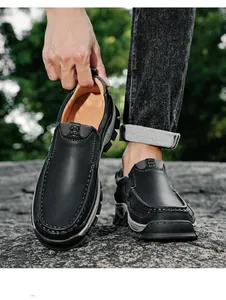 Detailed view of men's black leather slip-on loafers featuring durable outdoor lug soles