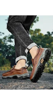 Detail view of men's brown leather slip-on outdoor loafers with rugged traction soles