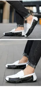 Detailed shot of men's breathable black and white leather loafers with slip-on design