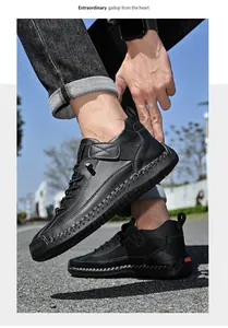 Detail shot of black hand-stitched leather walking shoes on a male model outdoors