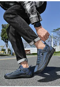 Detailed shot of blue mid-top casual leather shoes for men during outdoor activity