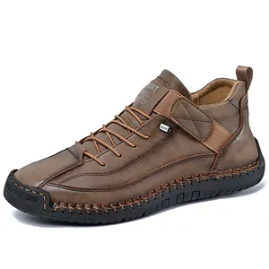 Men's mid-cut brown leather casual boot with outdoor work style and thick rubber sole