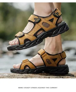 Side profile of men's brown leather outdoor sandals featuring adjustable straps and mesh