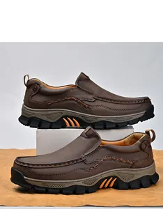 Detail view of brown men's outdoor leather shoes with durable non-slip soles