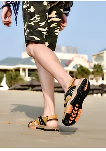 Detailed view of durable non-slip sole on men's outdoor beach sandals at the beach