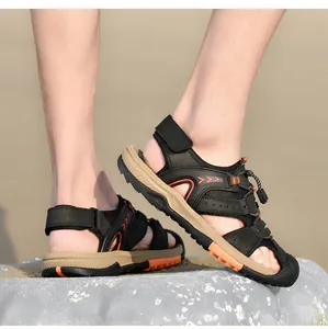 Close-up of men's closed-toe outdoor sports sandals on feet with orange accents