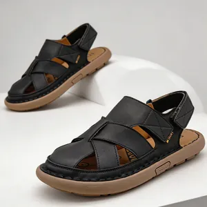 Black men's closed-toe sandals featuring breathable hollow design and tan soft soles