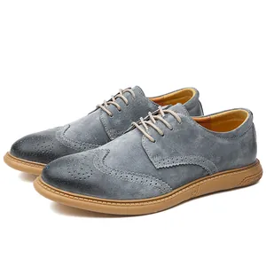 Detailed view of grey suede men's Brogue shoes featuring classic wingtip detailing