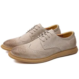 Detailed side view of men's beige suede Brogue shoes with wingtip perforations