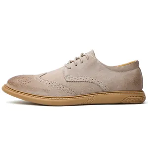 Detailed side profile of men's tan suede Brogue shoes with wingtip perforations.