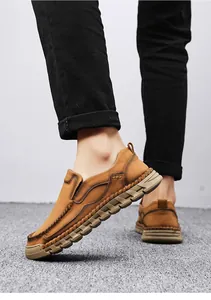 Detail of hand-stitched brown men's loafers with soft, lightweight soles.