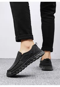 Side view detail of men's hand-stitched black loafers with flexible anti-slip soles