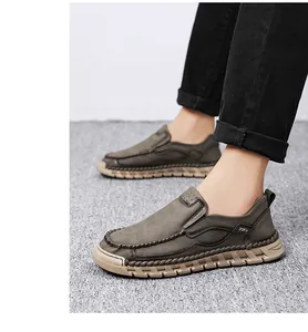 Close-up of men's slip-on casual loafers with handmade stitching and thick tan soles
