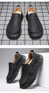 Detailed view of men's hand-stitched slip-on leather loafers with textured soft soles.
