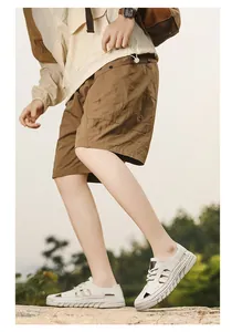 Detailed side view of breathable men's hollow-out closed-toe sandals for summer beach wear