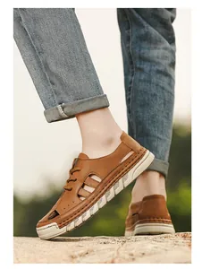 Detailed side view of brown leather hollow-out men's beach shoes for summer