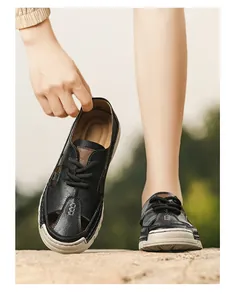 Breathable black hollowed-out men's leather sandals for beach or summer casual wear.