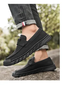 Detailed side view of men's vintage black casual loafers with soft rubber sole