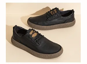 Close-up detail of black genuine leather men's casual shoes featuring thick textured gum soles