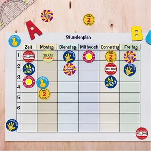 Colorful teacher reward stickers placed on a classroom timetable for student encouragement