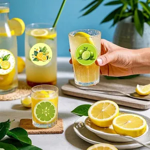 Vibrant round lemon graffiti stickers decorating cold beverage glassware in a sunny scene